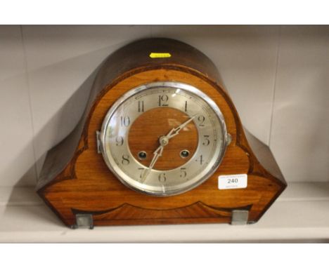 An Art Deco walnut and inlaid two hole mantel clock 