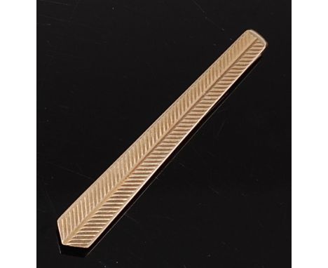 A 1960s 9ct gold engine turned tie-clip, shaped as a tie, maker Joseph Cook & Son, Birmingham 1965, 6g, 5.5cm   Condition Rep