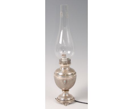An early 20th century probably Scandinavian silver lamp, of baluster form, with pierced collar over engine turned naturalisti
