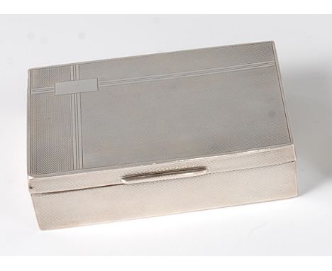 An Art Deco silver table cigarette box, having all-over engine turned exterior, with unfitted interior, stamped silver, 9.5oz