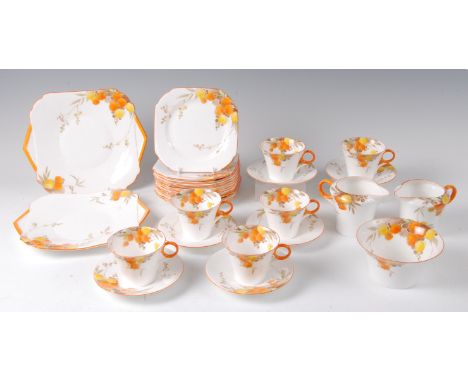 A 1930s Shelley Regent shaped bone china six place teaset, decorated with orange and yellow flower heads, comprising pair of 