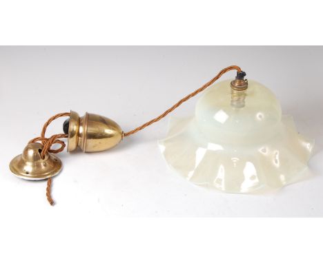 An Art Nouveau tinted vaseline glass hanging ceiling light, of domed form with wavy edge, having brass weighted fitting, with