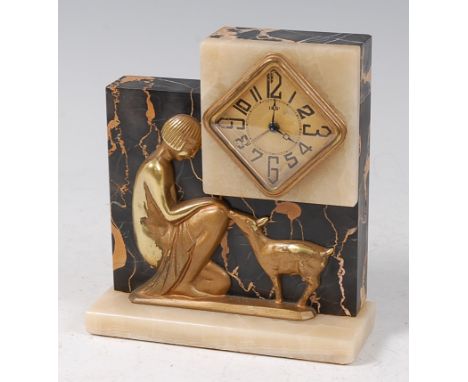 An Art Deco black variegated marble, onyx and gilt metal mounted bedside clock with alarm, the lozenge date dial with stylise