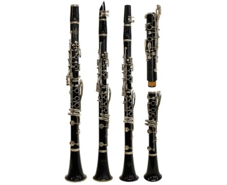 Four various cased clarinets, two Buffet Crampon &amp; Cie B12 Models, ser. no. 381674 and 458297; also an old Corton and ano