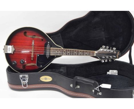 Stagg pear shaped electric mandolin, fitted with two tuning knobs, associated hard case 