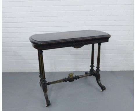 19th century ebonised card table in the Aesthetic manner, the rectangular top above a craved frieze, raised on twin column su