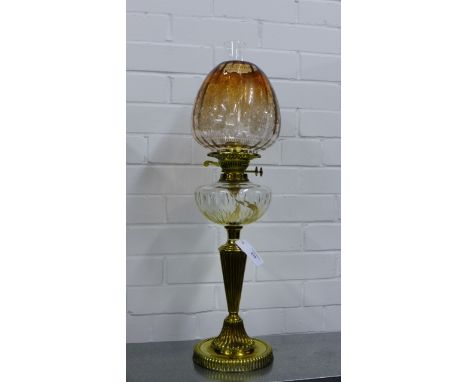 Brass stemmed paraffin lamp with rose tinted and etched glass shade and clear glass well, 68cm high 