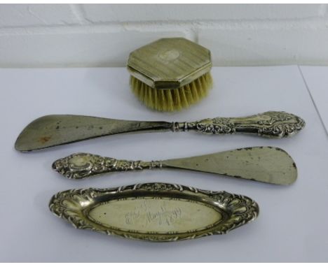 A mixed lot to include a Chester silver backed clothes brush, small Sterling silver trinket dish and a two silver handled sho