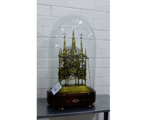 Victorian 'Lichfield Cathedral' brass repeating skeleton clock with pierced chapter ring and Roman Numerals above a plaque in