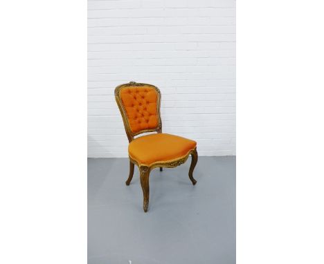 19 the century mahogany framed side chair with floral carvings and upholstered button back and shaped padded seat, raised on 