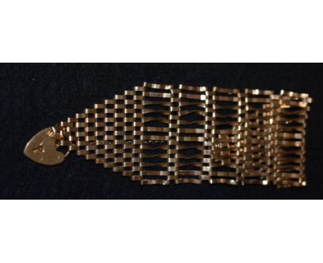 A 9ct gold wide gate bracelet, padlock clasp, 25.3g gross
