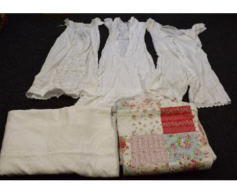Textiles - a Laura Ashley white Marcella bed cover; Victorian undergarments; a Victorian christening gown; a floral stitched 