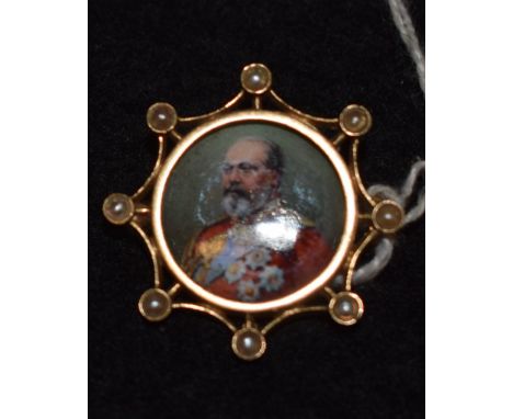 A George VI enamel portrait brooch, painted in full regalia, surrounded by an open eight point frame, each point inset with a