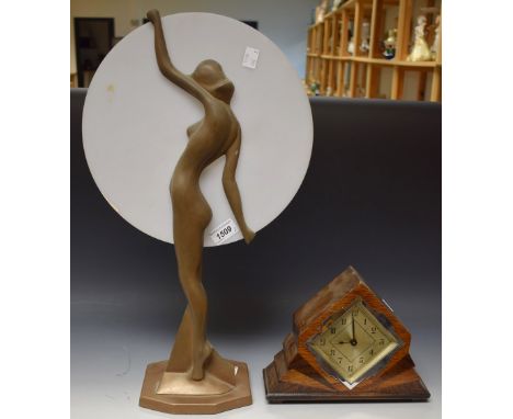 An Art Deco veneered oak fan shaped mantel clock; an Art Deco type lamp with nude lady holding disc shade (2) 