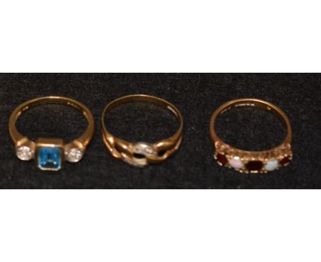 Rings - a ruby and opal five stone dress ring, 9ct gold shank, Birmingham 1972; a two tone diamond accented dress ring;  anot