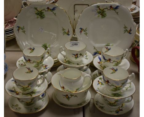 A Salisbury china ten setting tea service decorated with fanciful birds amongst branches, inc two bread plated, cups, saucers