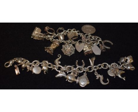 A silver belcher link charm bracelet suspending eighteen charms inc Seahorse, Turtle, Clam, Dolphin, Piranha fish etc, spring