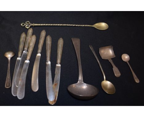 A silver sauce ladle, London hallmark, 1821; a caddy spoon, Birmingham; a set of six silver hafted butter knives, Sheffield h