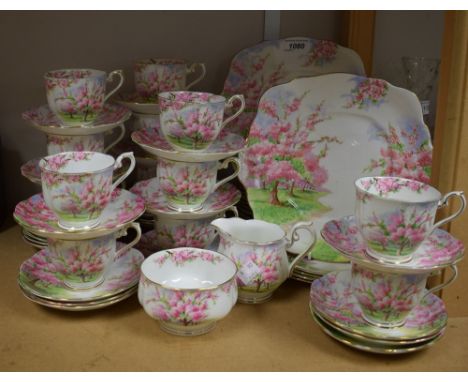 A Royal Albert Blossom Time tea service comprising thirteen cups, twenty four saucers, sixteen side plates, two sandwich plat