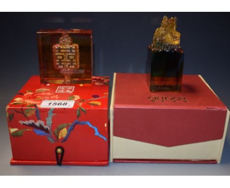 A Chinese glass sculpture of a dragon with the flaming pearl, cube base by Artbay, boxed; a Liuligongfang Knot of Happiness, 