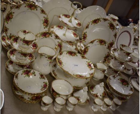 A Royal Albert Old Country Roses part dinner and tea service comprising dinner plates, side plates, cups and saucer, three ti