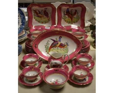 A Czechoslovakian tea and dessert service, transfer printed with fanciful birds within a pink border, early 20th century