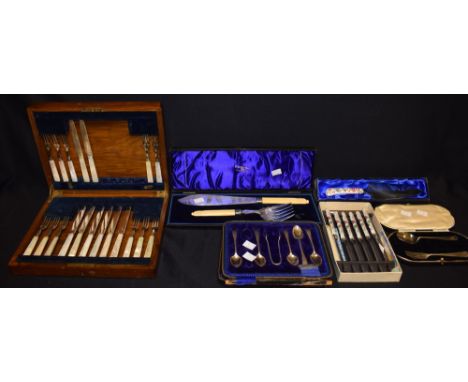 A silver part christening set, Sheffield, cased; a part set of silver teaspoons and sugar bows, cased; a pair of EPNS fish se