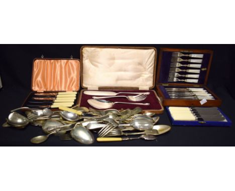 A set of six fruit knives and forks with silver ferrules 'mother of pearl' hafted, Sheffield 1921, oak cased; a desert servin