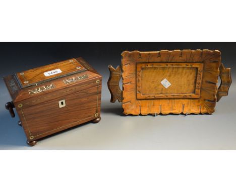 A rosewood tea caddy, mother of pearl inlay, bun feet; a carved wooden tray (2)