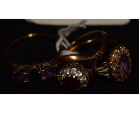 Rings - an amethyst and seed pearl cluster ring indistinctly marked yellow metal shank; others paste 9 carat; 8.7g gross (3)