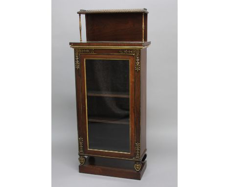 19TH CENTURY ROSEWOOD PIER CABINET, in the manner of George Bullock, with brass gallery and mounts, the glazed cupboard door 