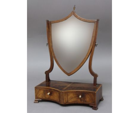 GEORGE III MAHOGANY  AND INLAID TOILET MIRROR, the shield shaped mirror on scrolling supports, the double concave base with i