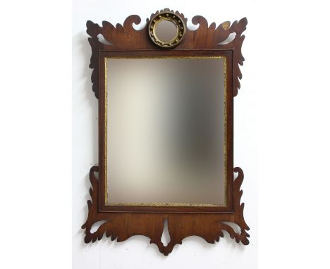 GEORGE III MAHOGANY FRET CARVED WALL MIRROR, the bevelled rectangular plate with parcel gilt border below a smaller convex bu