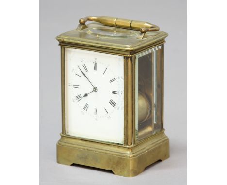 'GOLIATH' BRASS CARRIAGE CLOCK, the enamelled dial on an eight day repeating movement half hourly striking to a gong, serial 