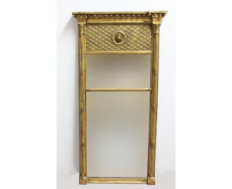 FRENCH GILT PIER MIRROR, 19th century, the double plate beneath a ball cornice and lion's head medallion, flanked by twisting