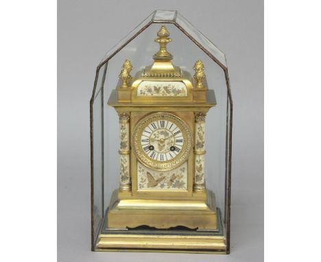 FRENCH BRASS AND ENAMELLED MANTEL CLOCK, the dial on a brass eight day movement striking to a gong, the dial, columns and pla