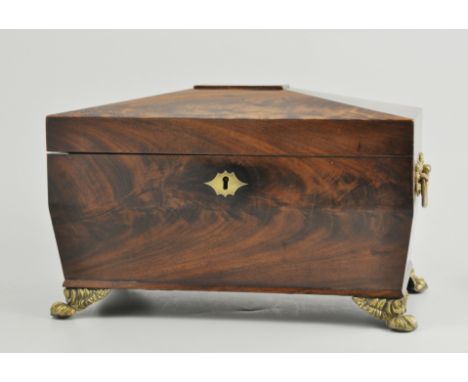 Georgian figured mahogany sarcophagus shape caddy box, flanked with two brass handles and raised on four feet, fitted interio