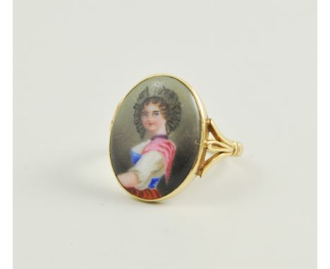 18ct gold ring, set within an enameled portrait panel, 3.8gm gross.