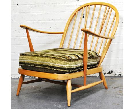 Ercol pale beech easy chair, with open arms.