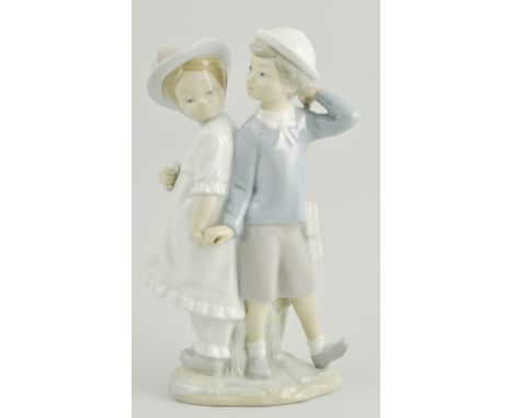 Lladro group of a boy and girl, "hand in hand", height 27cm.