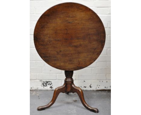 Georgian mahogany pedestal table, circular tilt-top, baluster column on tripod legs, diameter 78cms.