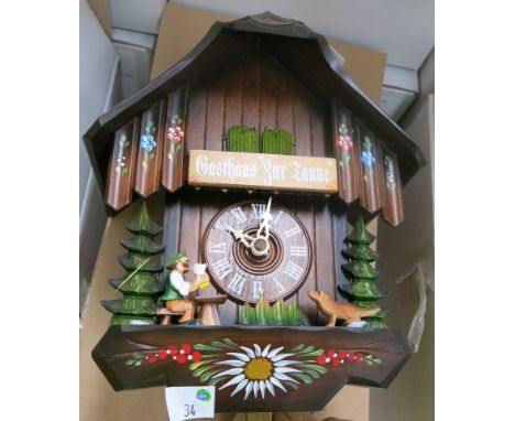 * Black Forest wooden painted cased cuckoo clock with weight driven movement 
