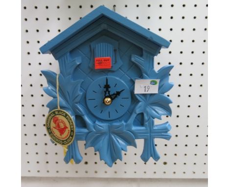 * German pastel blue cased small cuckoo clock with weight driven movement 