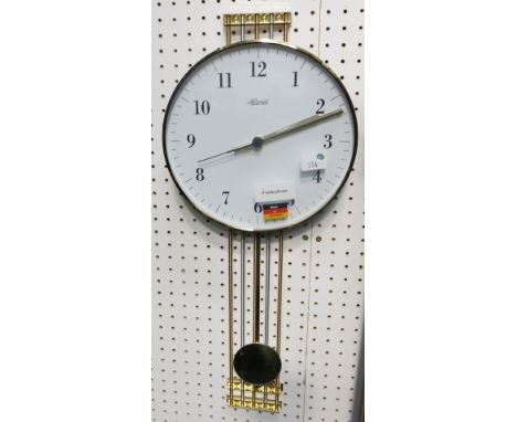 * Hermle quartz circular wall clock with brass surround railed design 
