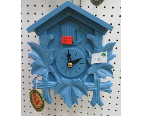 * German pastel blue cased small cuckoo clock with weight driven movement 