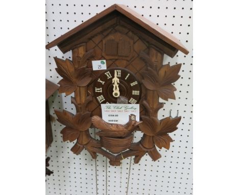 * German wooden cased cuckoo clock with weight driven movement RRP £156
