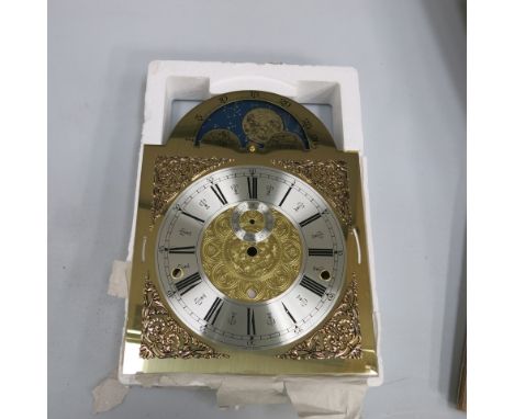 * Four German brass longcase clock dials with silver chapter rings & moon roller facility (stock no D2021) 33 cm x 25 cm over