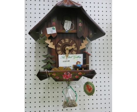 * German wooden bodied cuckoo clock with weight driven movement RRP £327