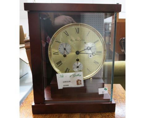 * Franz Hermle & Sohn key wound multi functional bracket type clock in mahogany case with day, date and month dial RRP £1855 