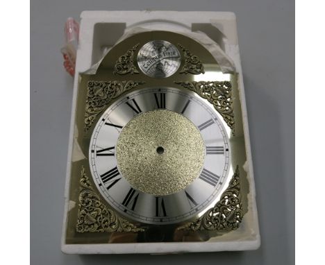 * Ten brass ''Tempus Fugit'' longcase clock dials with silvered chapter rings 33 cm x 25 cm overall